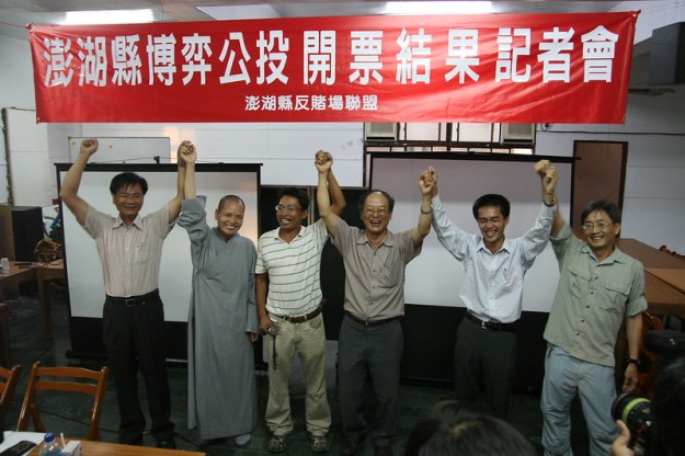 Anti-gambling activists celebrate a victory in the Penghu casino referendum